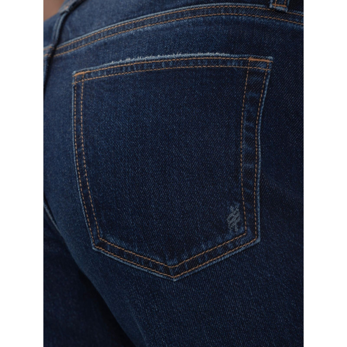 Close-up of the back pocket on Silver Willow Relaxed Straight Leg Woolwich jeans, featuring contrasting stitching and subtle embroidery on dark denim.