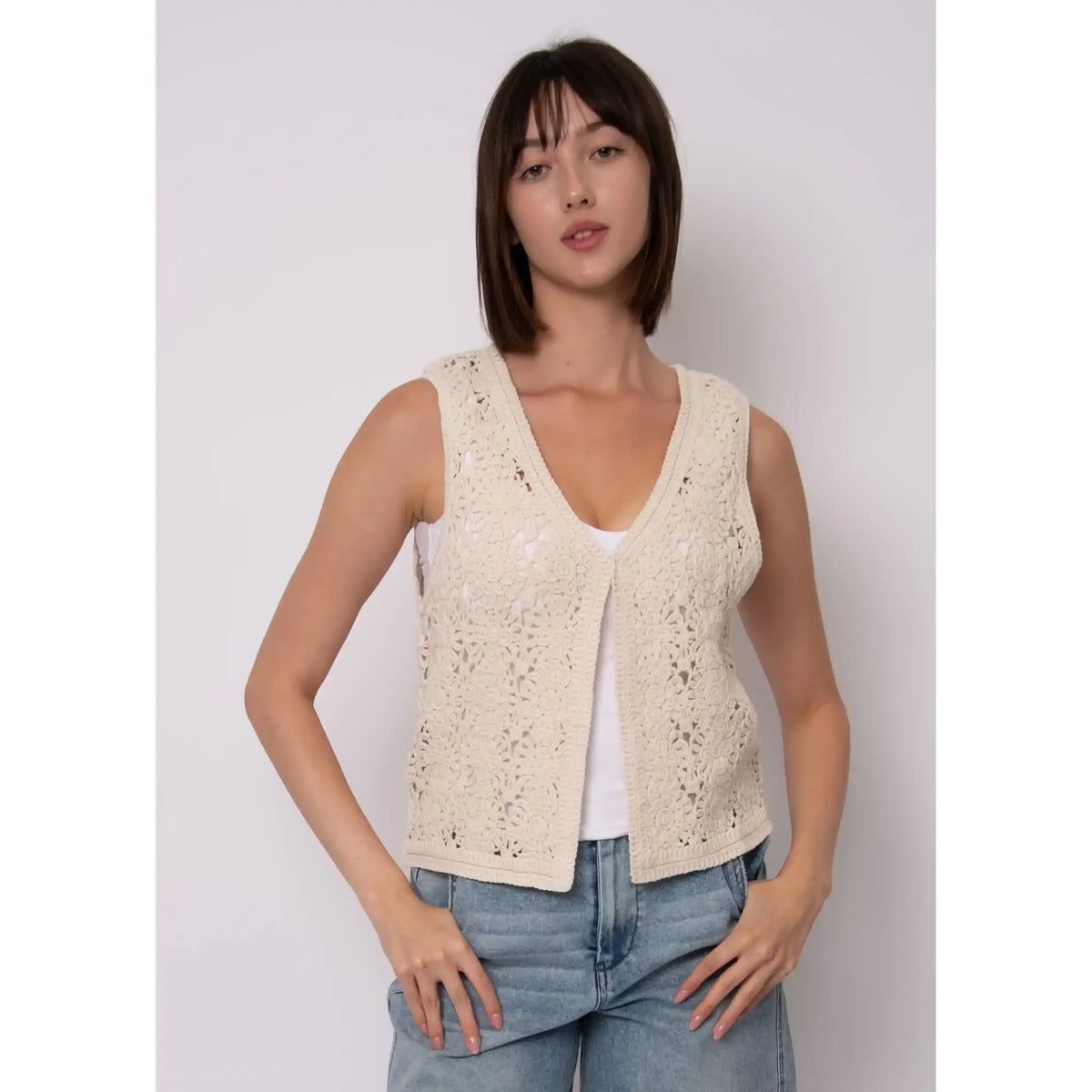 Sloane Knit Cardigan: cream sleeveless crochet-knit with single button, layered over a white tank.