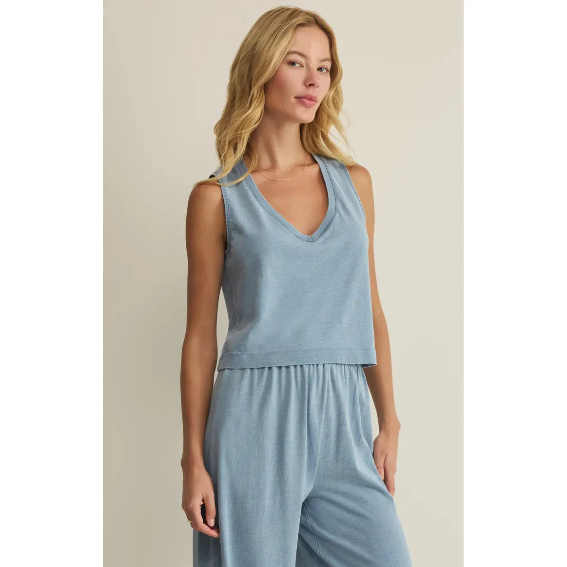 Model wearing light blue Z Supply Sloane V-Neck Tank with matching lounge pants in cotton jersey.