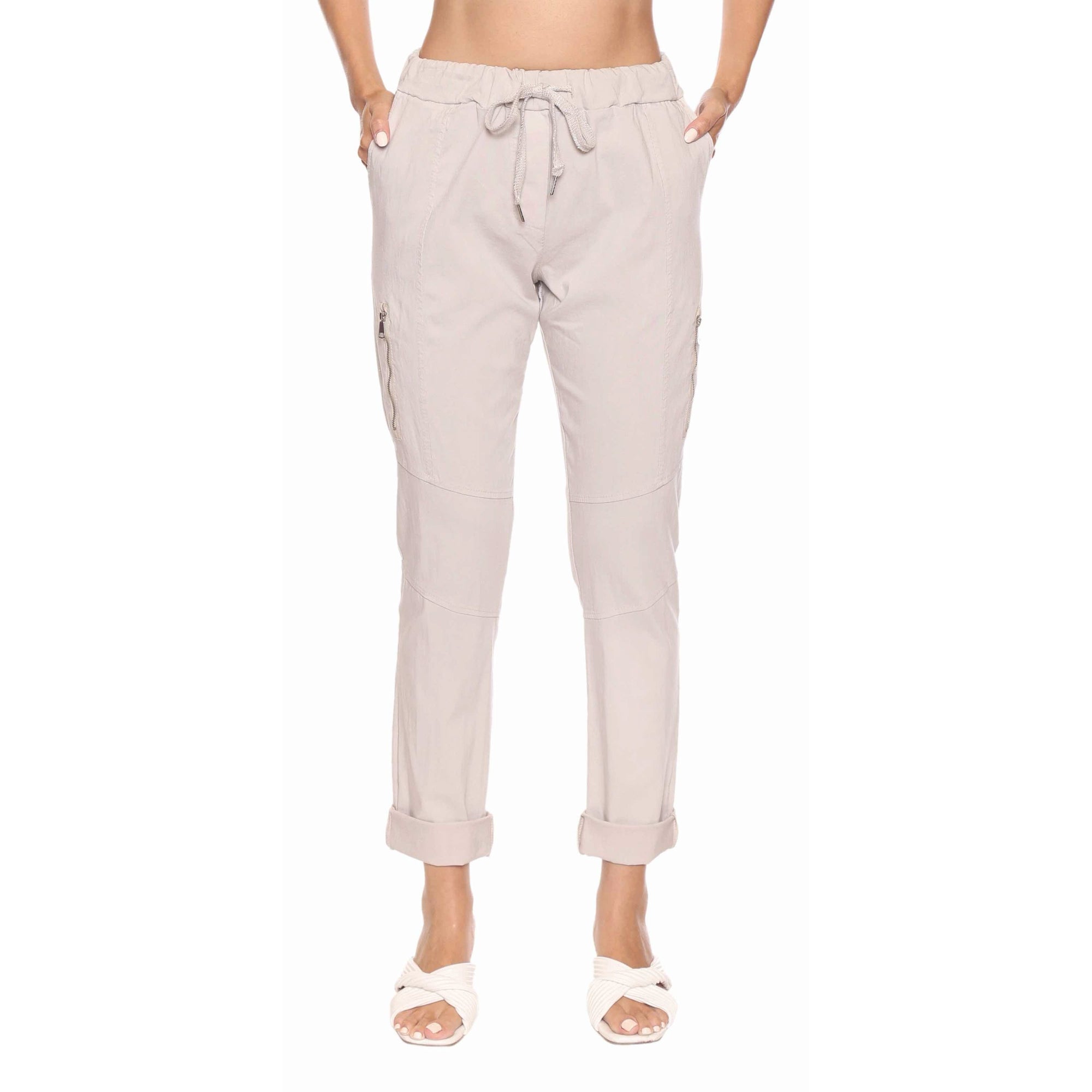 Sorella Pant with Zipper Detail Sand: beige joggers with drawstring waist, zip pockets, and rolled cuffs.