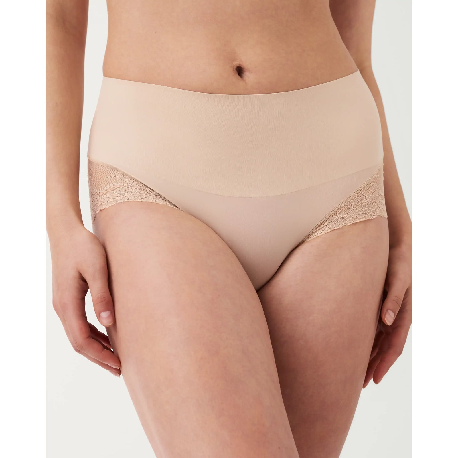 SPANXsmooth Undie-tectable Lace Hi-Hipster on a model; seamless nude underwear with lace sides.