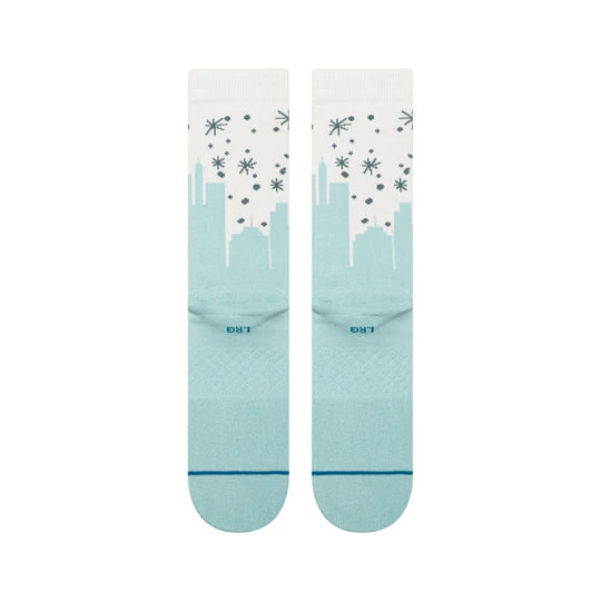 Stance Big City Elf Crew Socks featuring teal city skyline, snowflakes, cushioned footbed, seamless toe.