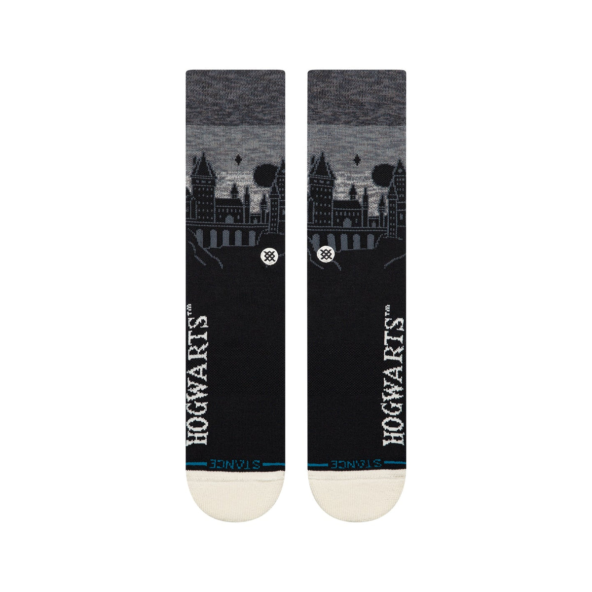 Black Stance crew socks featuring a silhouetted Hogwarts Castle skyline, vertical white Hogwarts text, and cream toe.