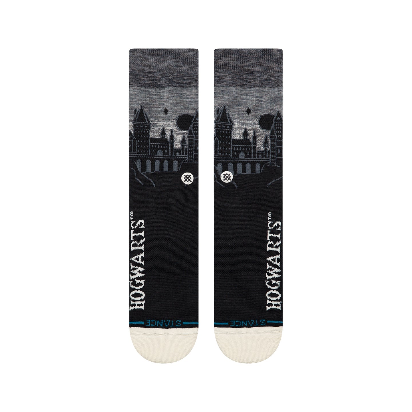 Black Stance crew socks featuring a silhouetted Hogwarts Castle skyline, vertical white Hogwarts text, and cream toe.