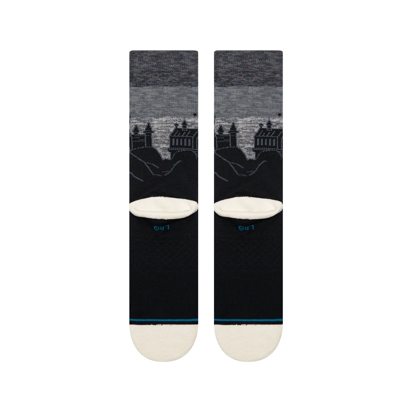 Black crew socks featuring a grey night sky and silhouetted Hogwarts Castle towers. Includes medium cushioning and cream toe.