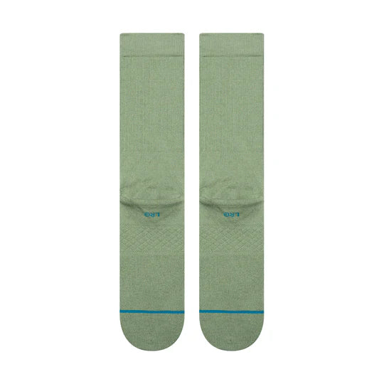 Two sage green Stance STP Icon Crew Socks with seamless toe and targeted cushioning.