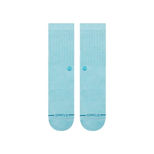 Two light blue Stance Icon Dyed Crew Socks with ribbed cuffs and a small logo.