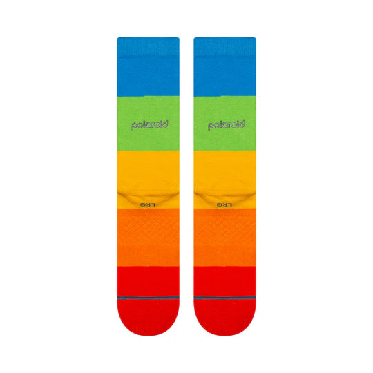Two rainbow-striped Stance Polaroid Snap Shot Crew Socks with blue, green, yellow, orange, red bands and Polaroid logo.