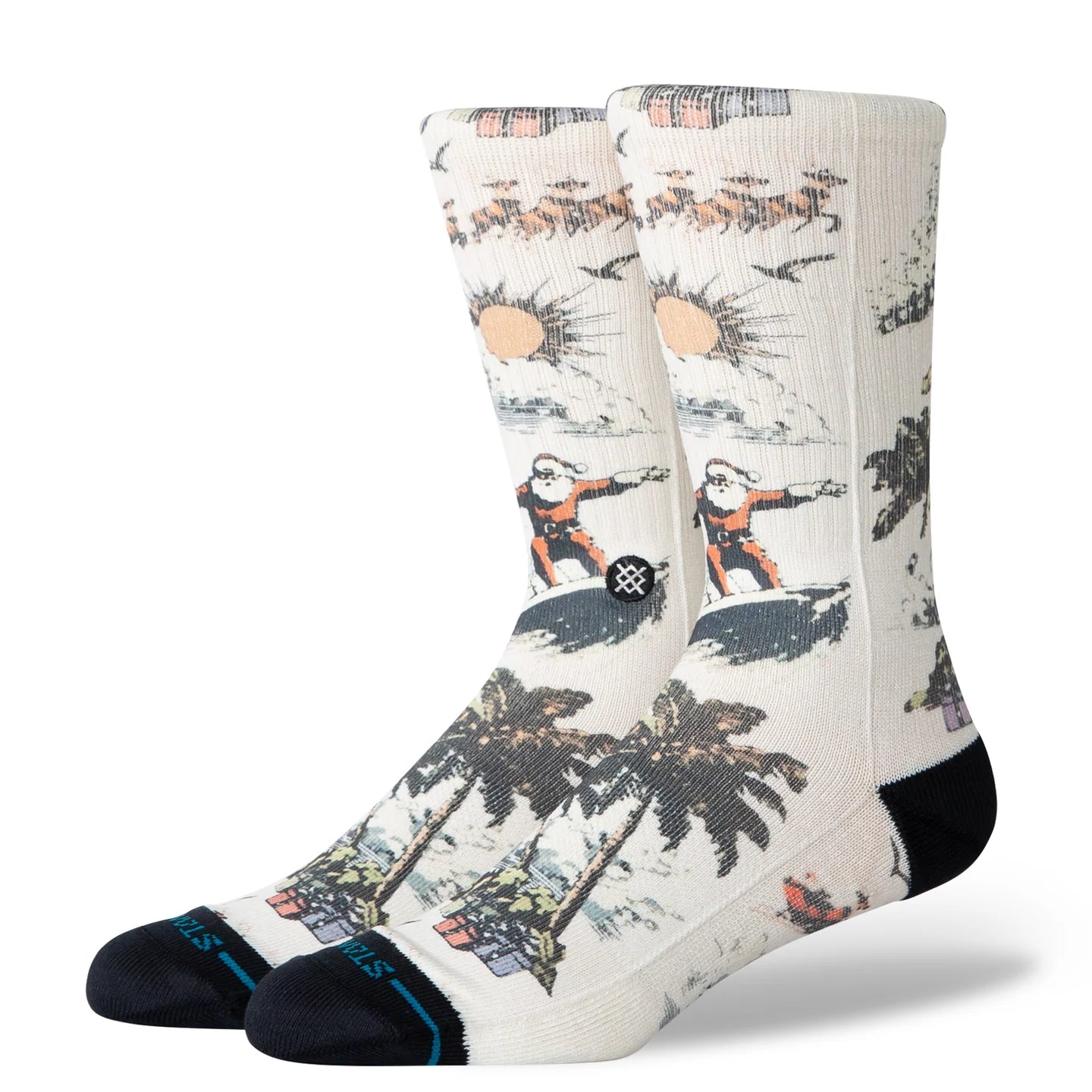 Cream Stance crew socks featuring a Santa surfing graphic with palm trees, reindeer, and a black toe and heel.