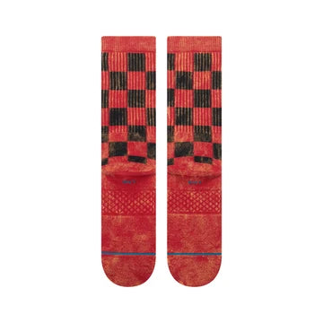 Red Stance Santarchy crew socks featuring a black and red checkered cuff, textured red body, and blue accent line.