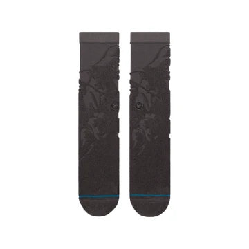Black Stance crew socks featuring a dark, reversed Star Wars Darth Vader graphic knit design with a blue accent stripe at the toe.