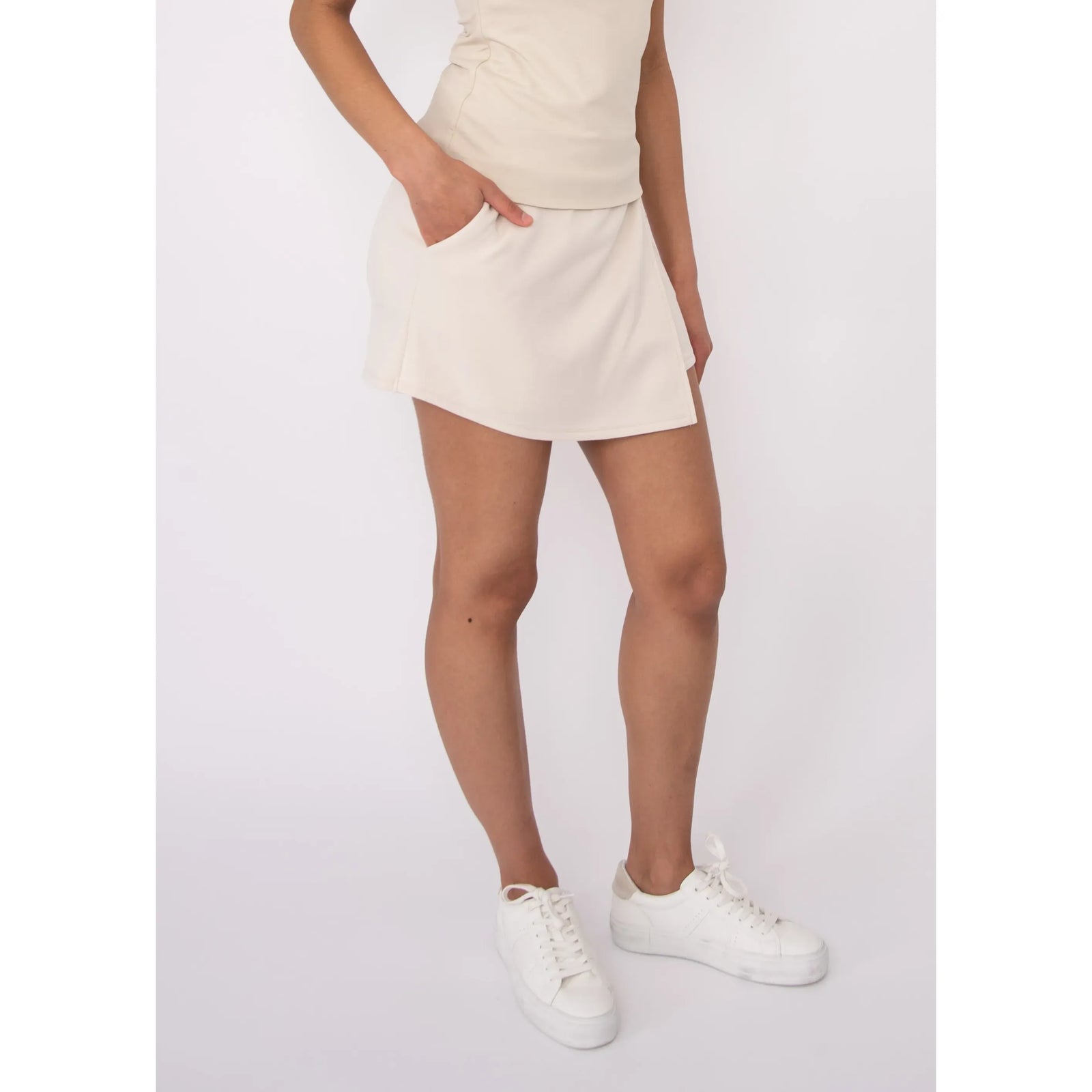 Starry Soft Knit Skort in cream with pockets, relaxed summer wear in cozy knit fabric.