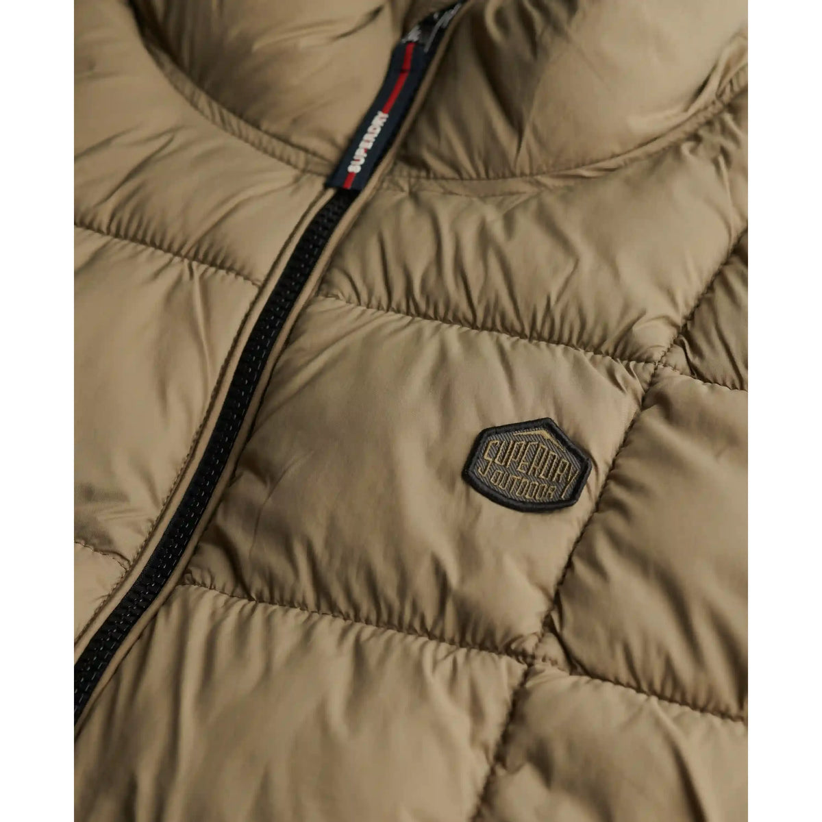 Tan Superdry Box Quilt Fuji Lite Gilet with front zip and logo patch.