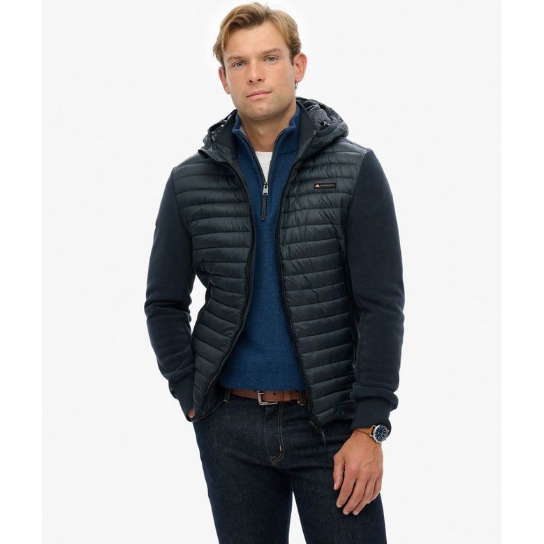 Model wearing Superdry Hooded Storm Fleece: quilted padded body with plush fleece sleeves.