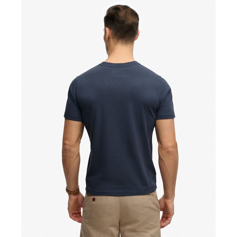 Back view of navy Superdrydry Retro Outdoor Relaxed Tee worn by a man.