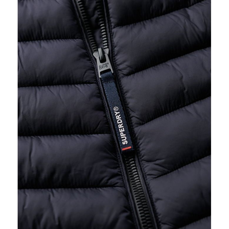 Superdry Fuji Sport Padded Gilet in navy, quilted with lightweight padding, zip closure, and logo pull tab.