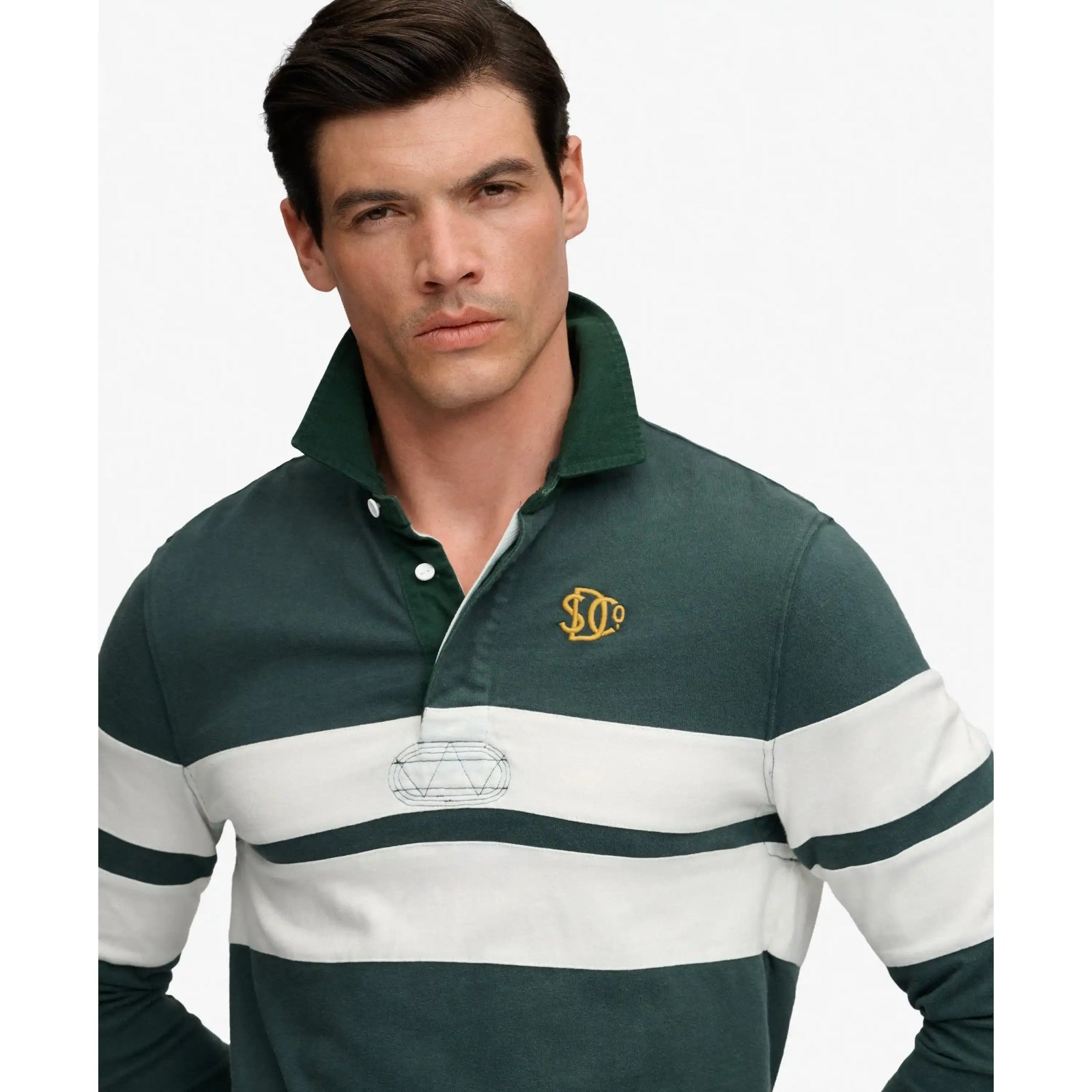 Superdry Vintage Athletic Stripe Rugby Top in dark green with white stripe and embroidered chest logo.
