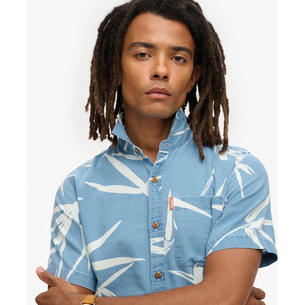 Superdry Vintage Loom short-sleeve shirt worn by a male model; light-blue with white loom pattern and chest pocket.