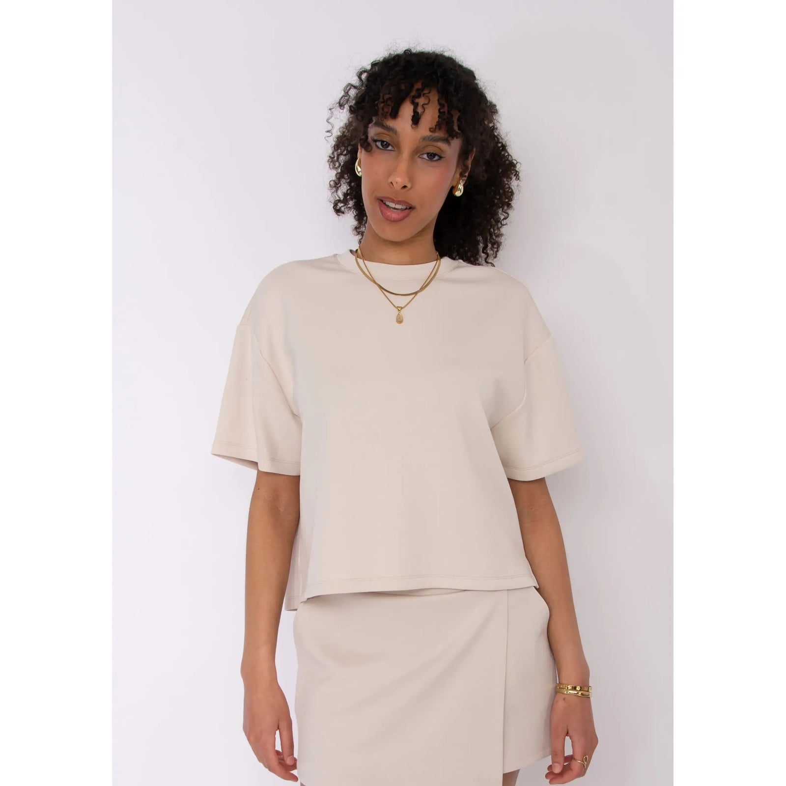Tess Soft Knit Top in beige, boxy fit, short-sleeve crew neck, ultra-soft knit fabric.