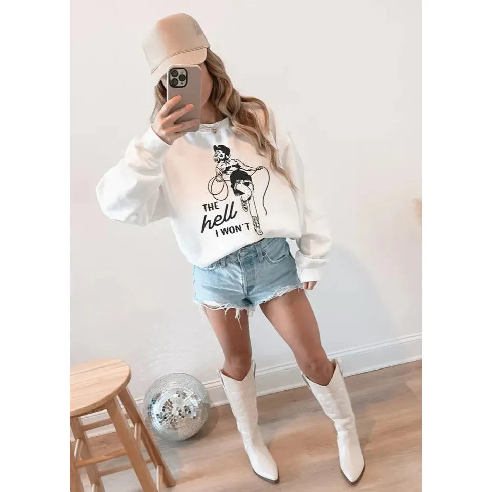 Stylish model wearing The Hell I Won&#39;t Crew sweatshirt paired with shorts and boots for a sassy wardrobe statement.