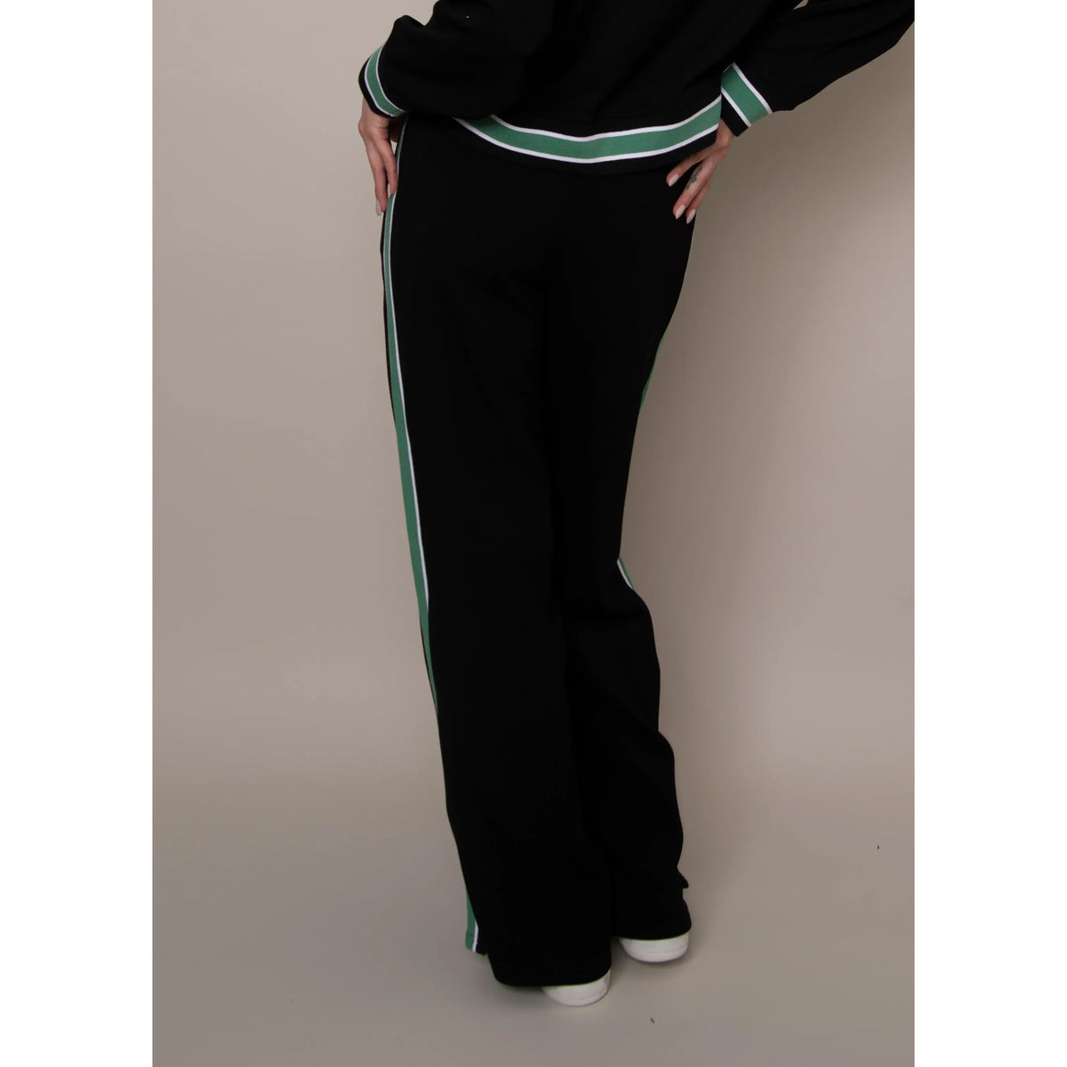 Valencia soft-knit pull-on jogger pants in black with green and white side stripes.