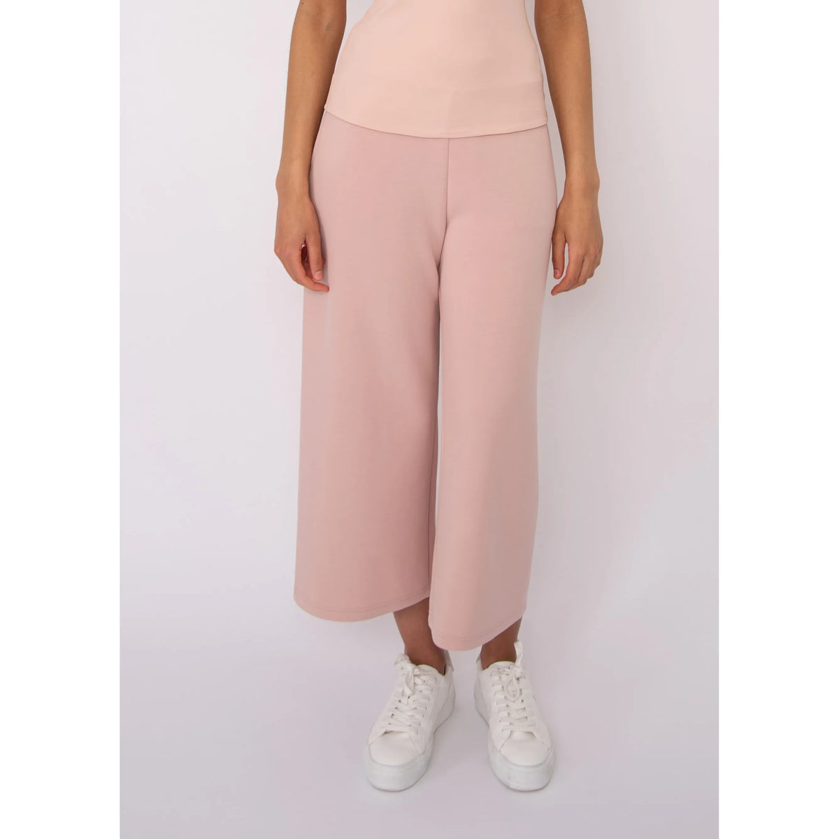 Victoria Soft Knit Cropped Pants in blush pink with a wide leg and pockets, modeled in size Small.