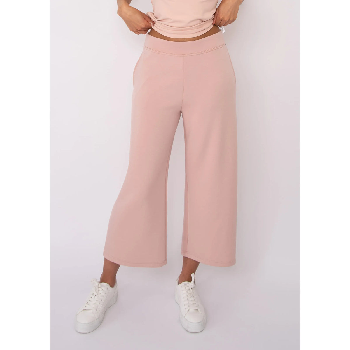 Victoria Soft Knit Cropped Pants in blush pink, high-waisted, wide-leg with pockets.