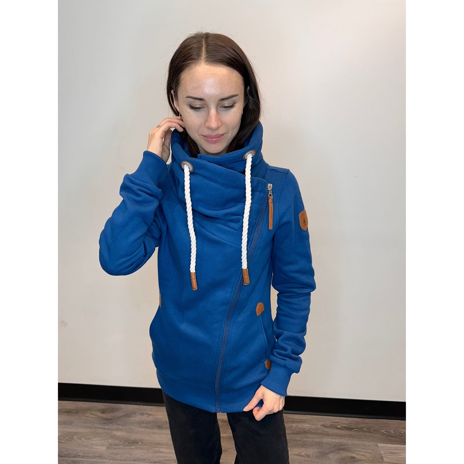 Cozy and stylish, the Wanakome Hestia Zip Up features a funnel neck and asymmetrical zipper for a flattering fit.