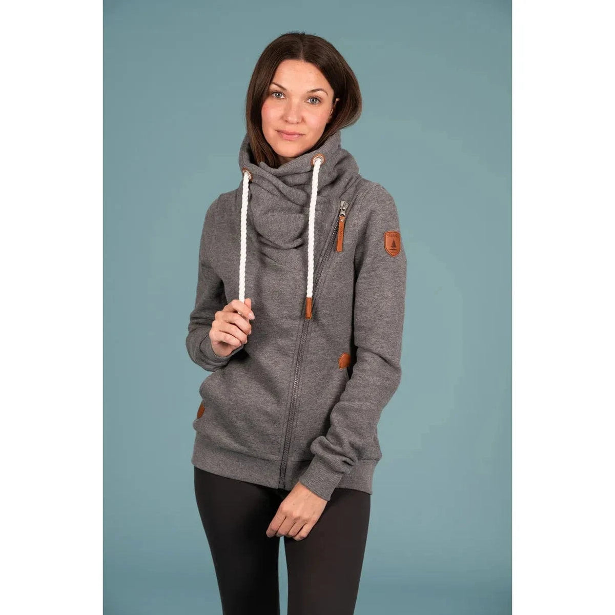 Wanakome Hestia Zip Up in dark heather grey features a cozy funnel neck and stylish asymmetrical zipper.