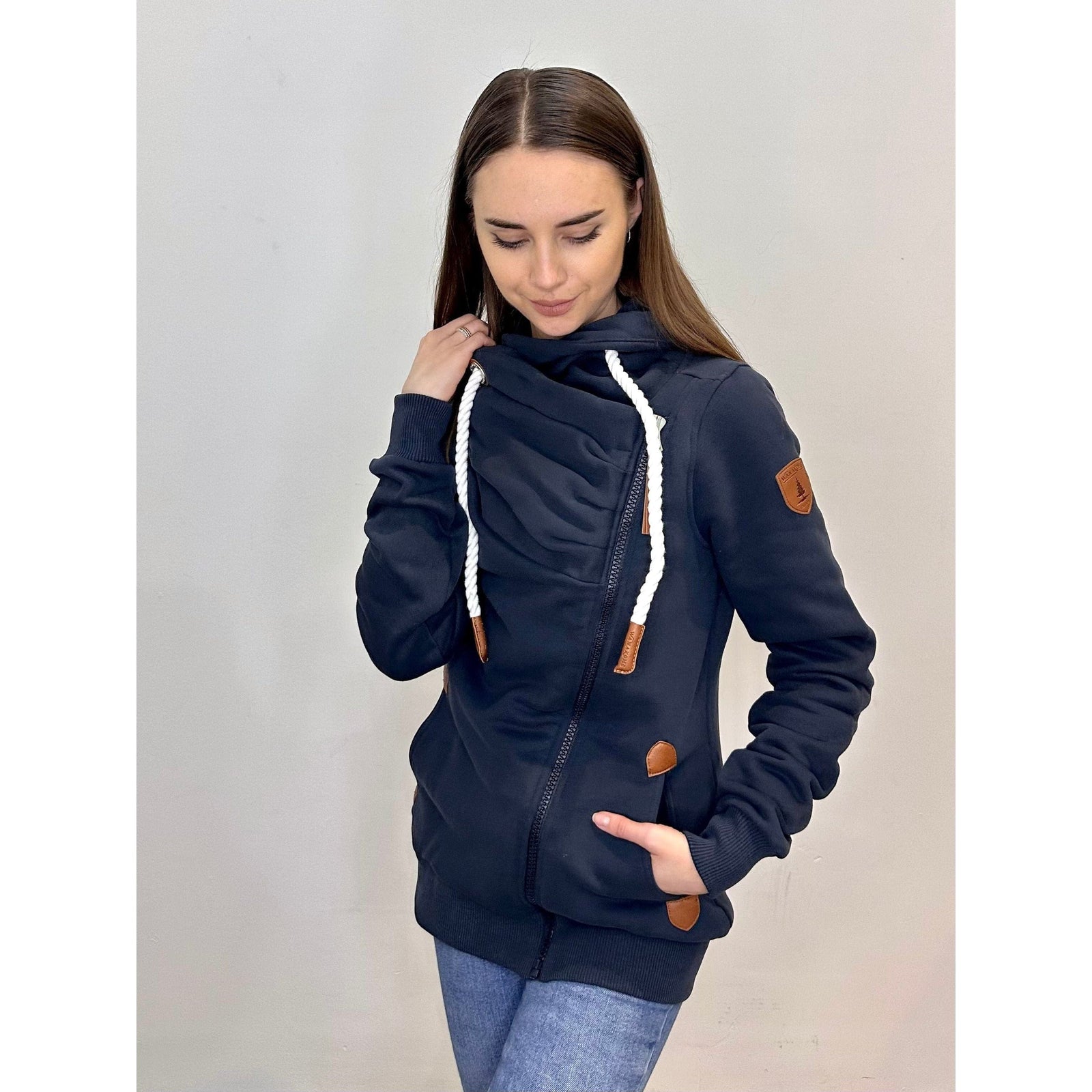Stylish Wanakome Hestia Zip Up with cozy funnel neck and asymmetrical zipper, perfect for layering and comfort.