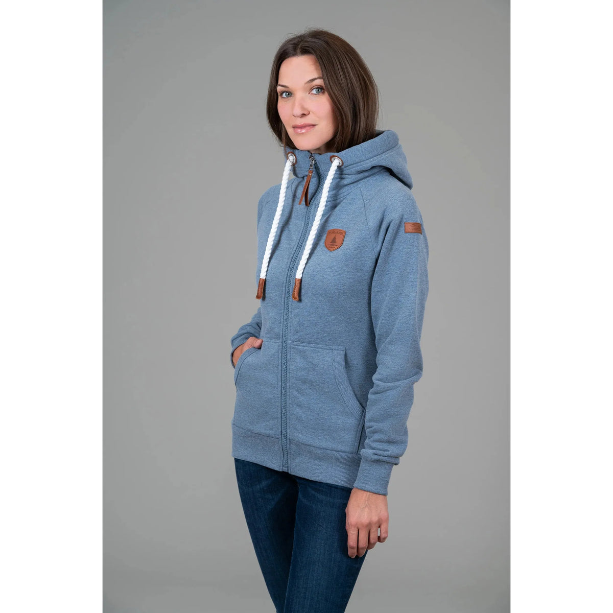 Blue Wanakome Hera Zip Front Hoodie with white drawstrings, vegan leather patches on chest and sleeve, front pockets.