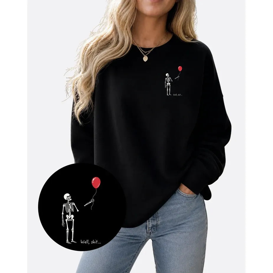 Well Shit Cozy Crew black pullover with skeleton and red balloon on chest; Alberta-printed, Canadian Blonde Ambition.