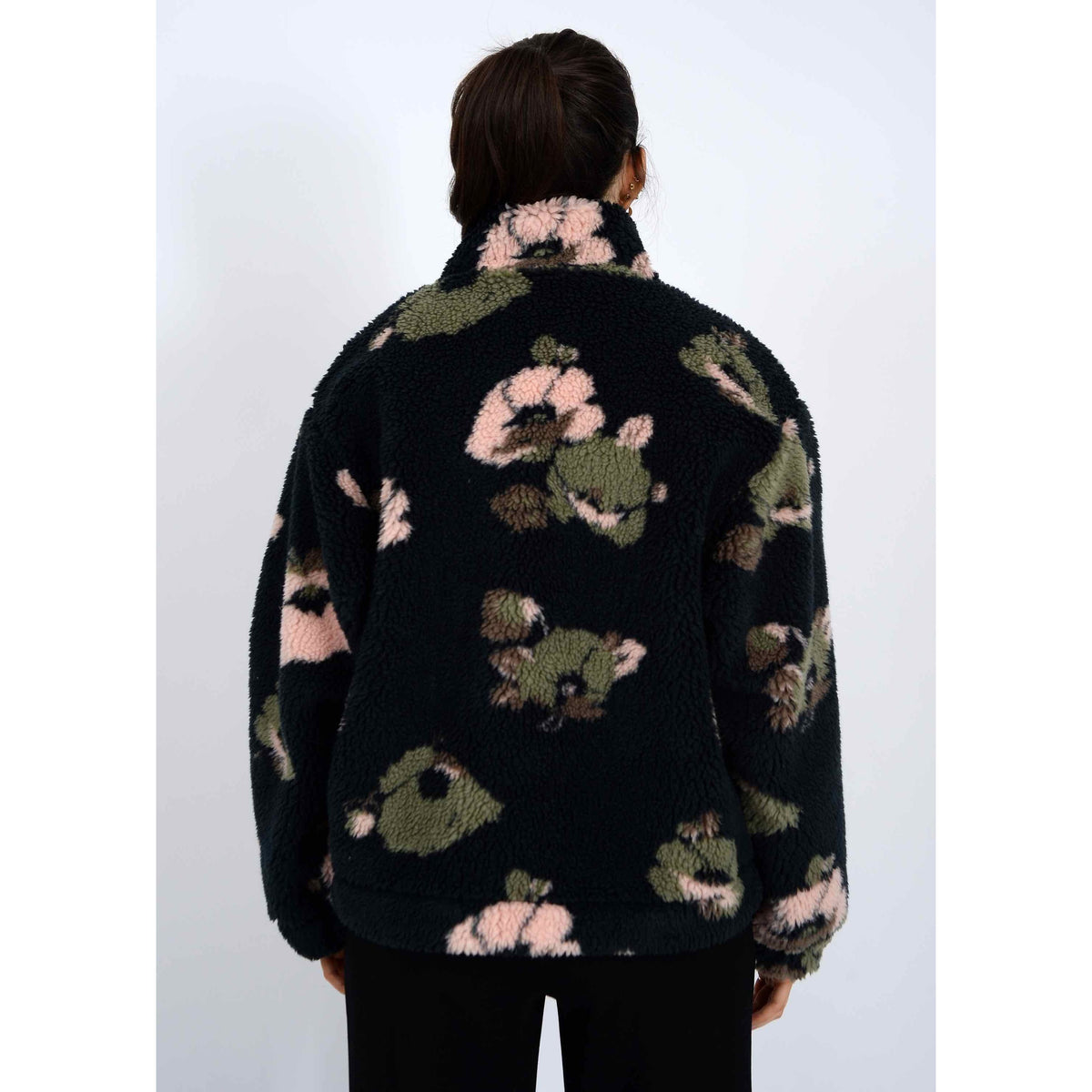 Whistler Sherpa Jacket: back view of black sherpa with pink and olive floral print and a mock collar.