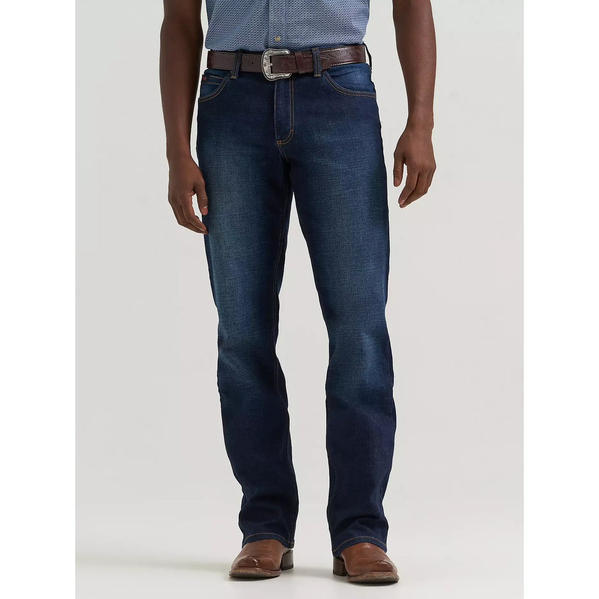 Wrangler 20X Active Flex Regular fit Twilight jeans with brown belt on a model