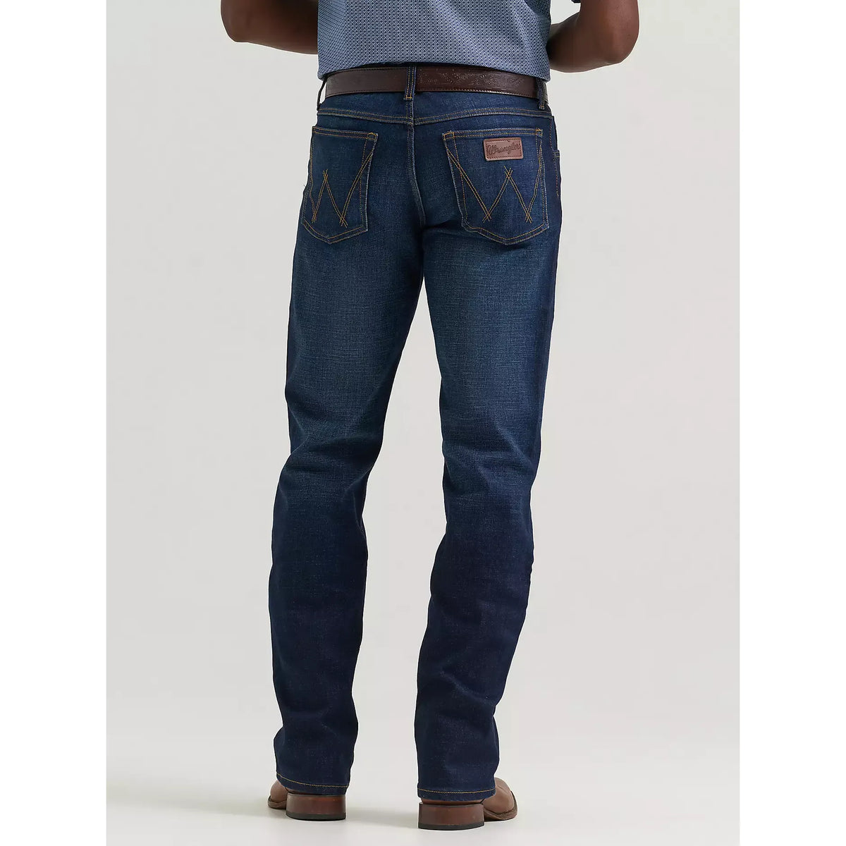 Back view of Wrangler 20X Active Flex Regular Twilight jeans in dark indigo with W-stitch back pockets.