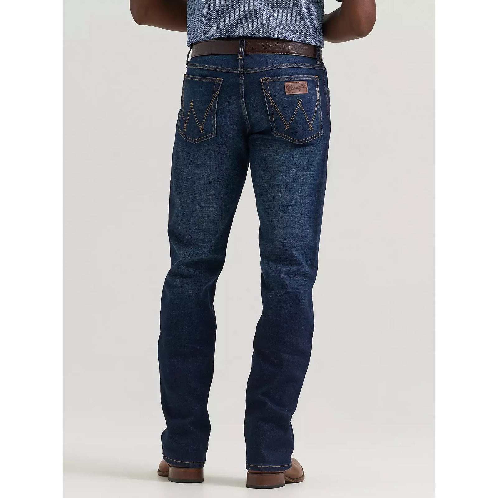 Back view of Wrangler 20X Active Flex Regular Twilight jeans in dark indigo with W-stitch back pockets.