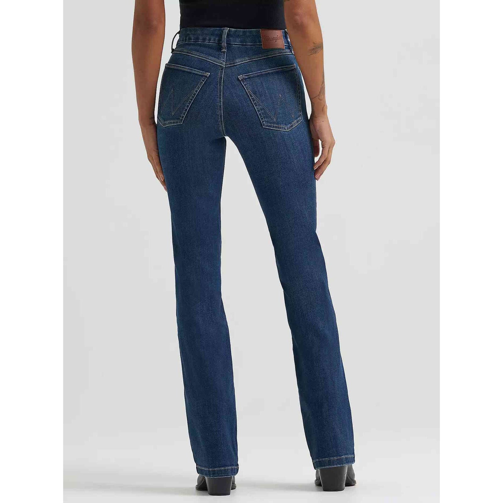 Back view of Wrangler Bespoke Bootcut in Lacey jeans on a model, contoured high-rise waistband and five-pocket styling.