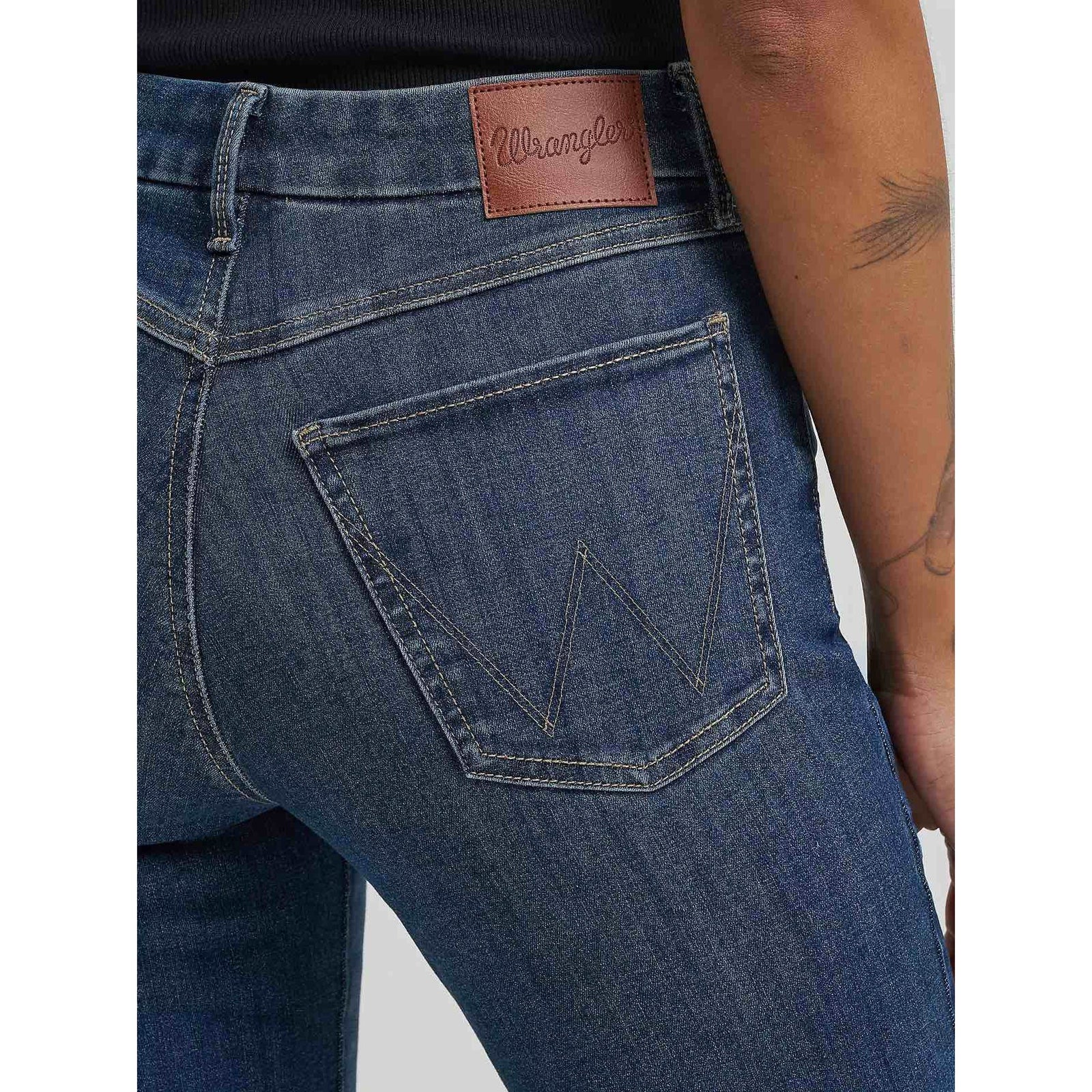 Wrangler Bespoke Bootcut in Lacey jeans with leather logo patch on waistband and back pocket stitching.