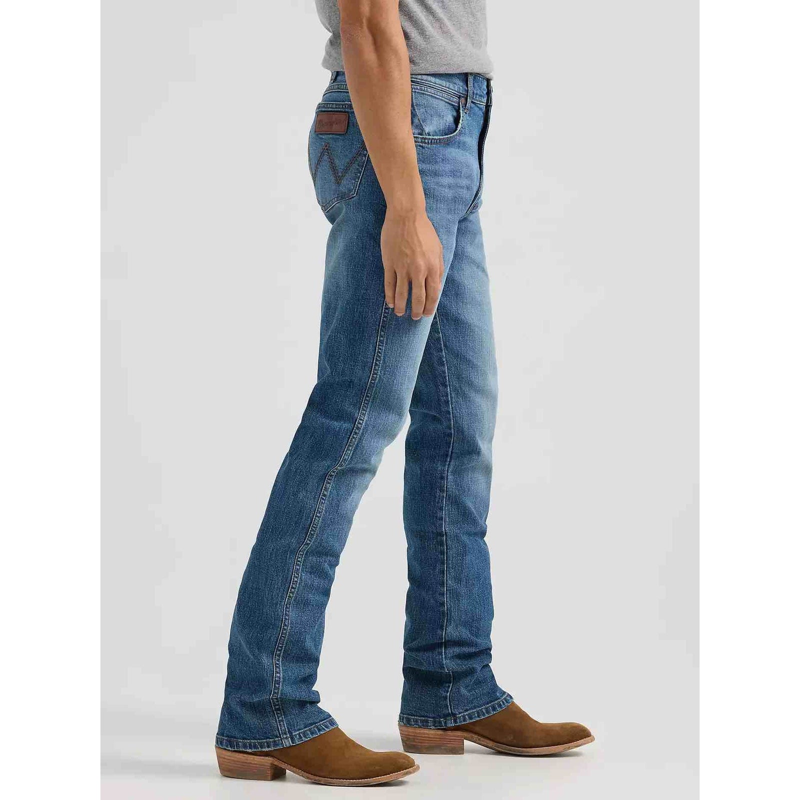 Wrangler Western Retro Slim Bootcut Jeans in Harris wash worn by a model, front view with brown boots.