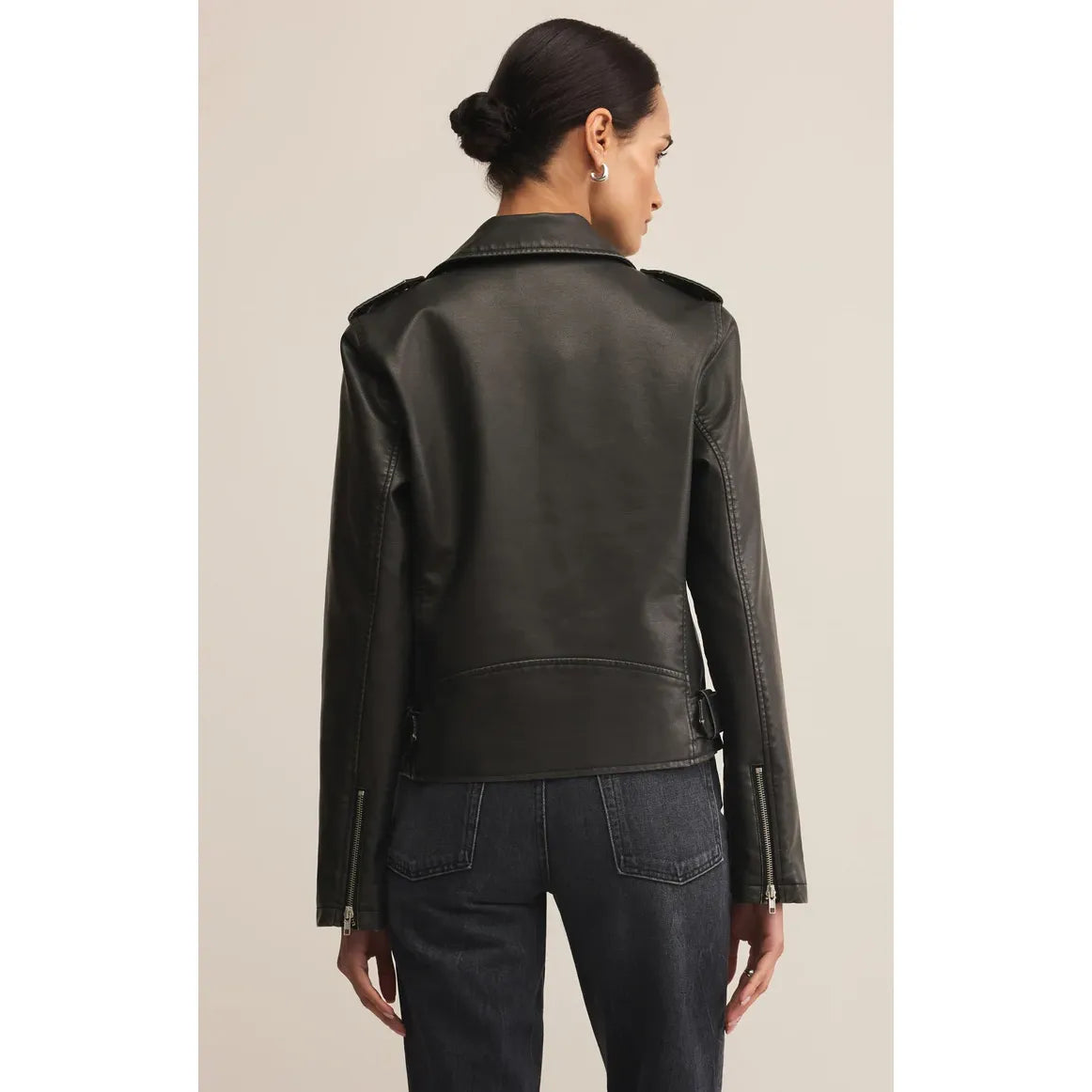 Z Supply Alchemy Faux Leather Moto Jacket back view on model with zippered sleeves, sleek faux leather moto style.