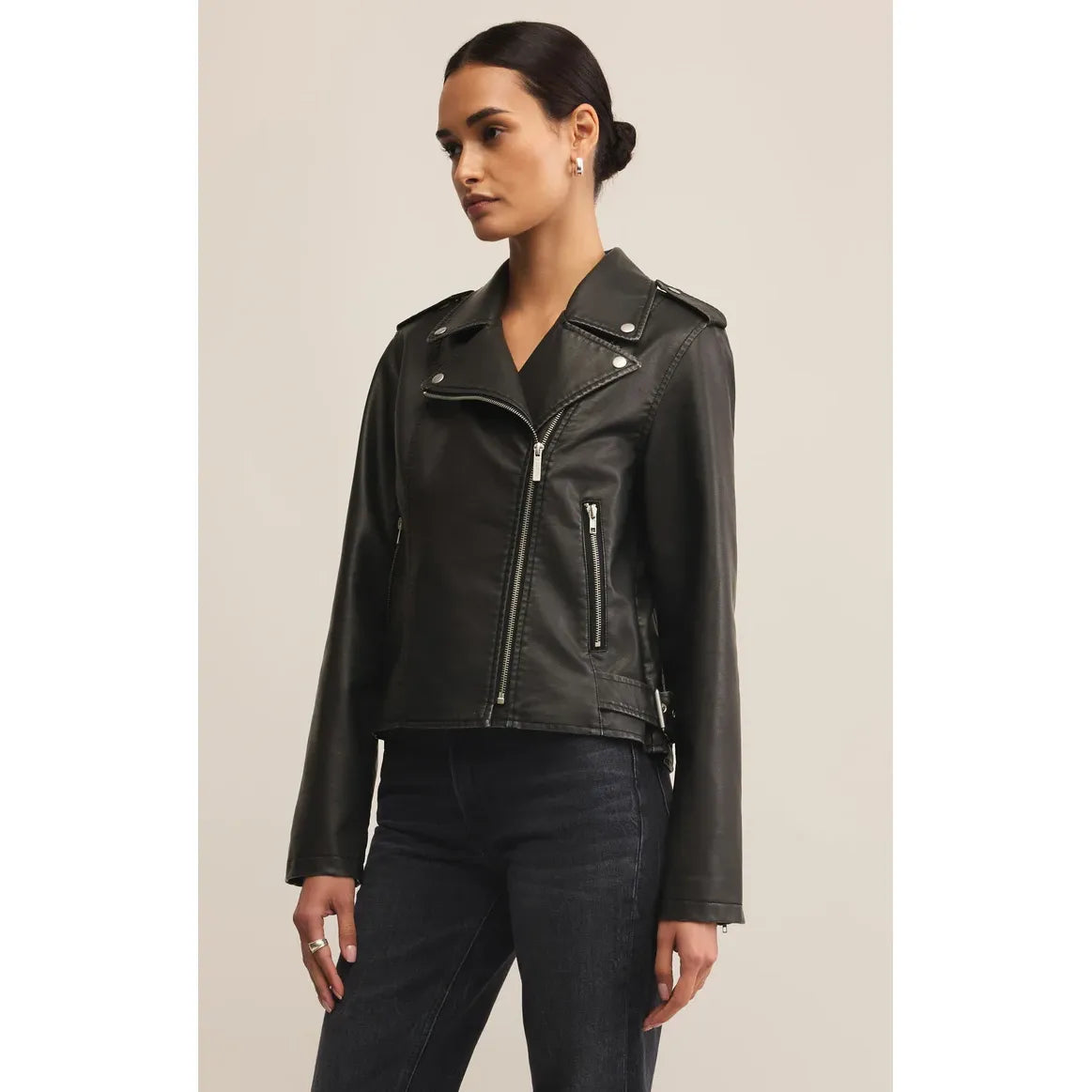 Z Supply Alchemy Faux Leather Moto Jacket on a model; sleek black biker with zip front and pockets.