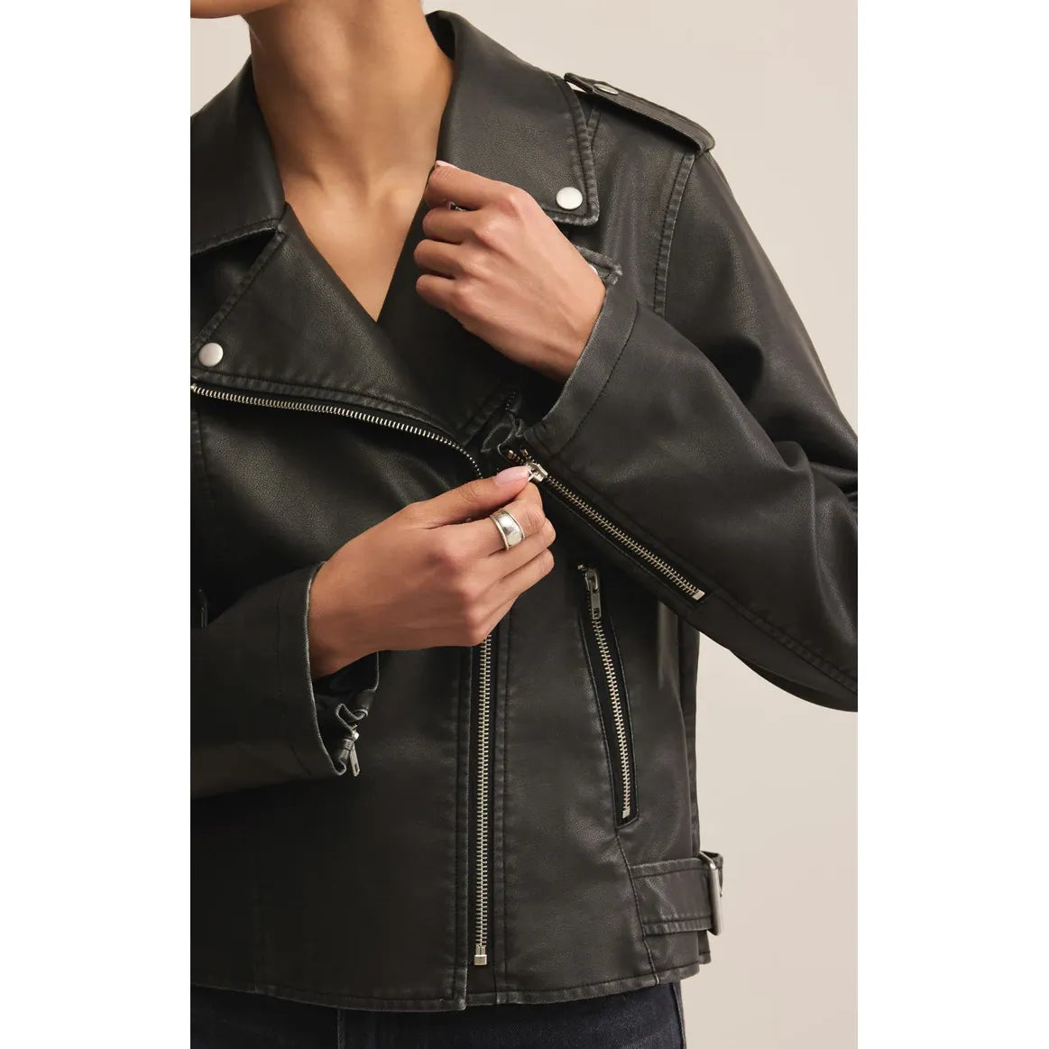 Z Supply Alchemy Faux Leather Moto Jacket on a model with bold front zipper and zip pockets.
