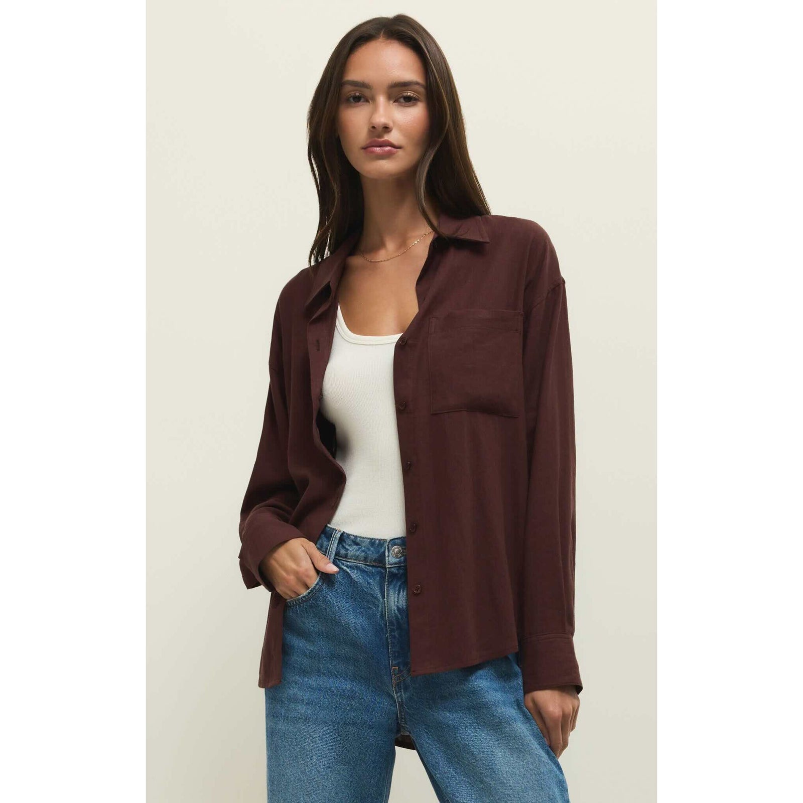 Model wearing burgundy linen Z Supply Alfie Button Up Shirt over a white tank, with a chest pocket and relaxed fit.