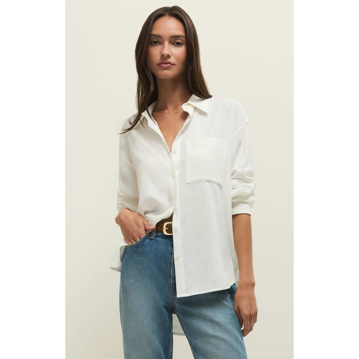 Z Supply Alfie Button Up Shirt in white linen with front pocket, relaxed drape and classic collar, worn with jeans.