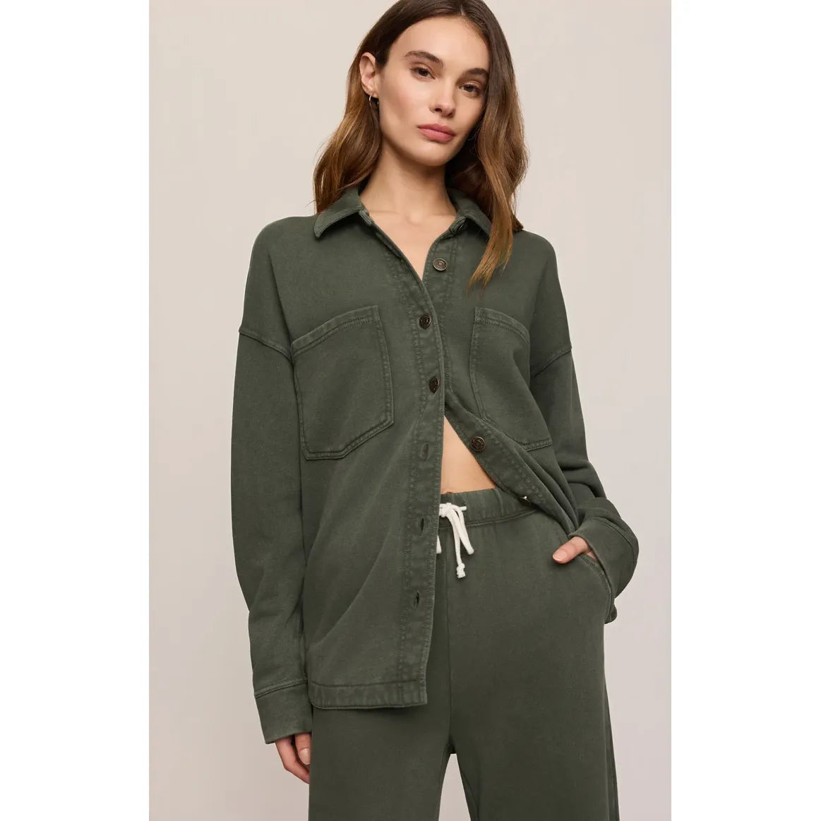Olive green Z Supply All Day Knit Jacket featuring a collar, front pockets, and button closure with matching drawstring pants.