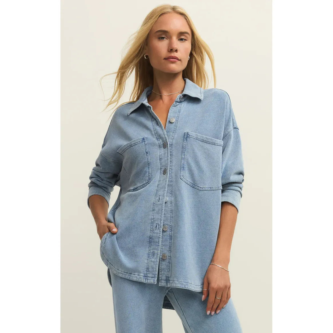 Model wearing Z Supply All Day Knit Denim Jacket in light wash with front pockets and button-down closure.