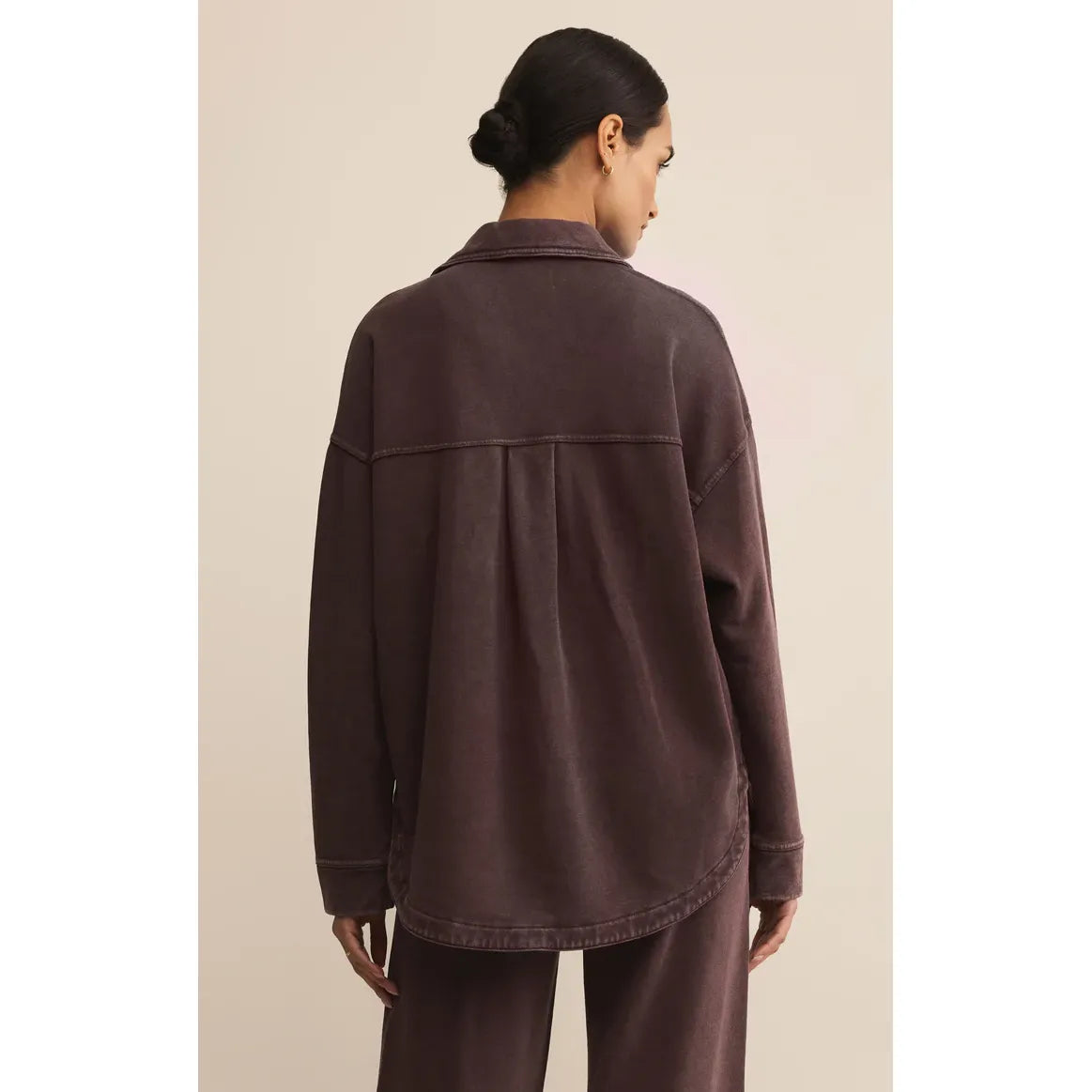 Back view of a model wearing the Z Supply All Day Knit Jacket in brown, oversized, vintage-inspired silhouette.
