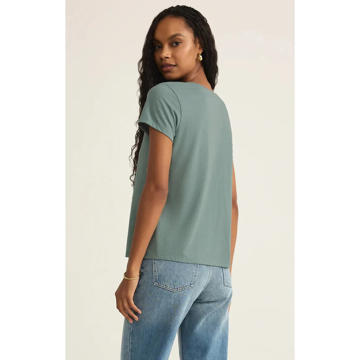 Stylish woman wearing the Z Supply Anywhere Scoop Tee in sea pine, perfect for casual adventures and everyday comfort.