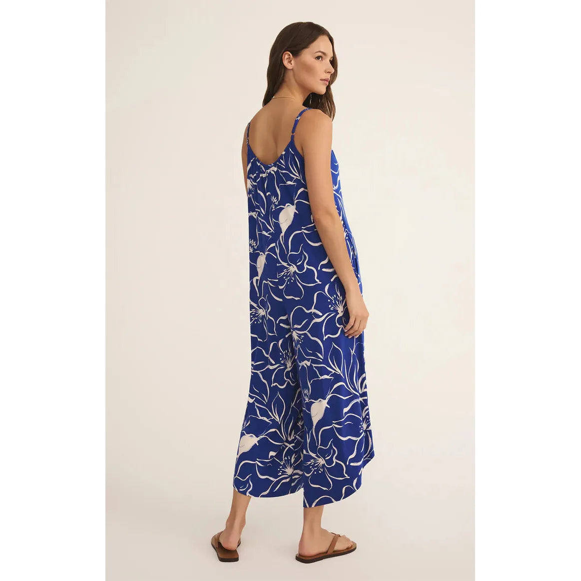 Z Supply Cala Floral Jumpsuit features a vibrant floral print and flared cropped legs for effortless vacation style.