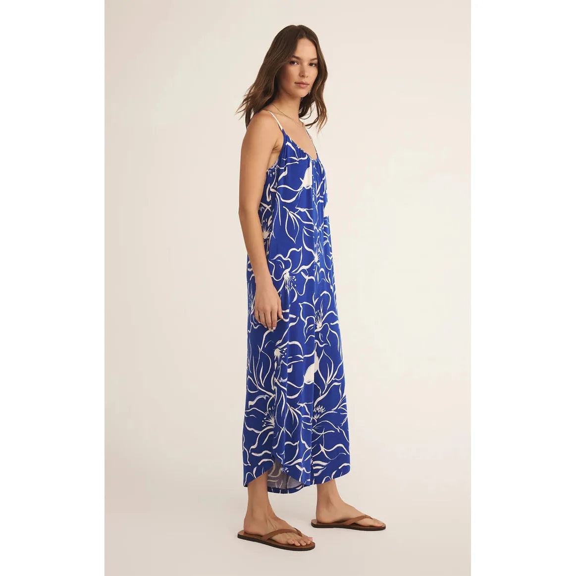 Z Supply Cala Floral Jumpsuit features a vibrant tropical print and flared legs for effortless vacation style.
